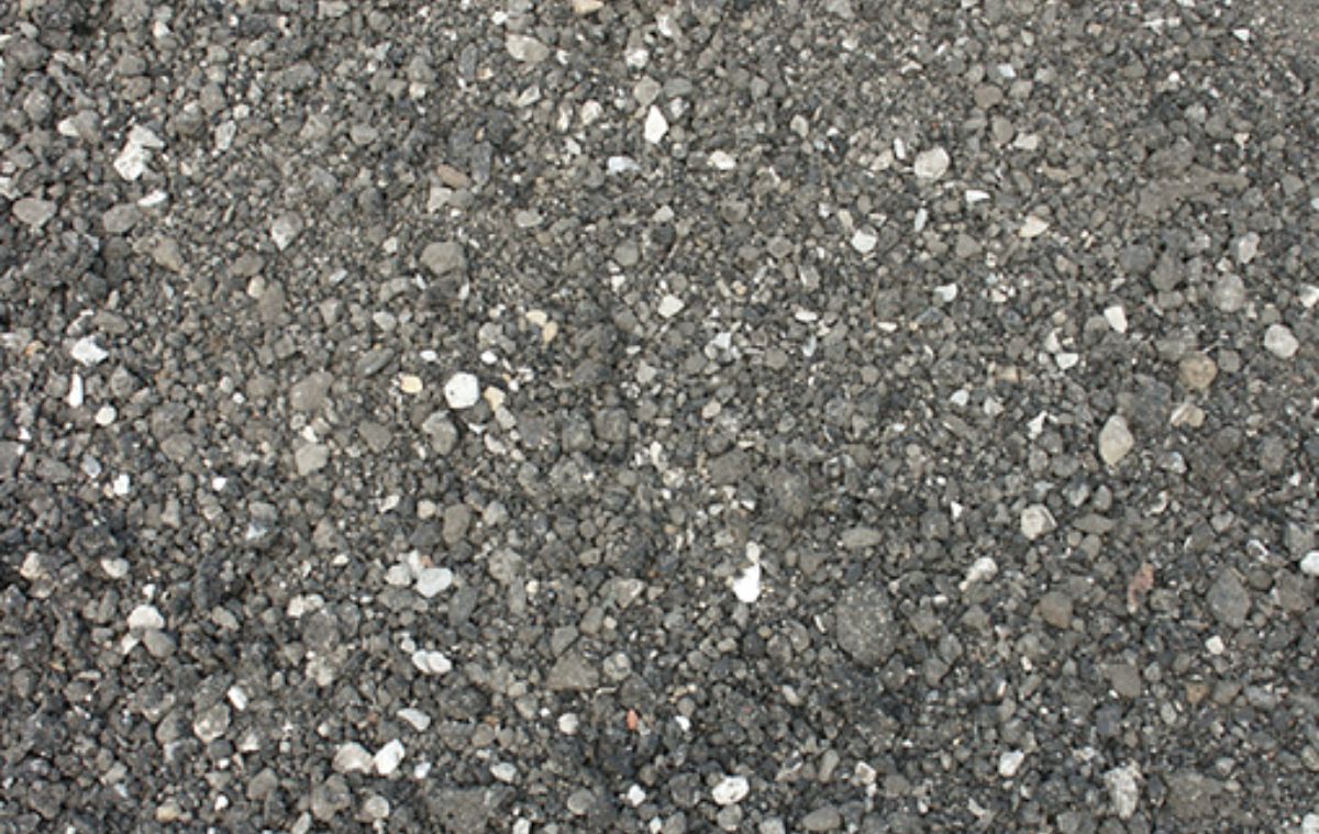 Close-up of a dark grey gravel surface