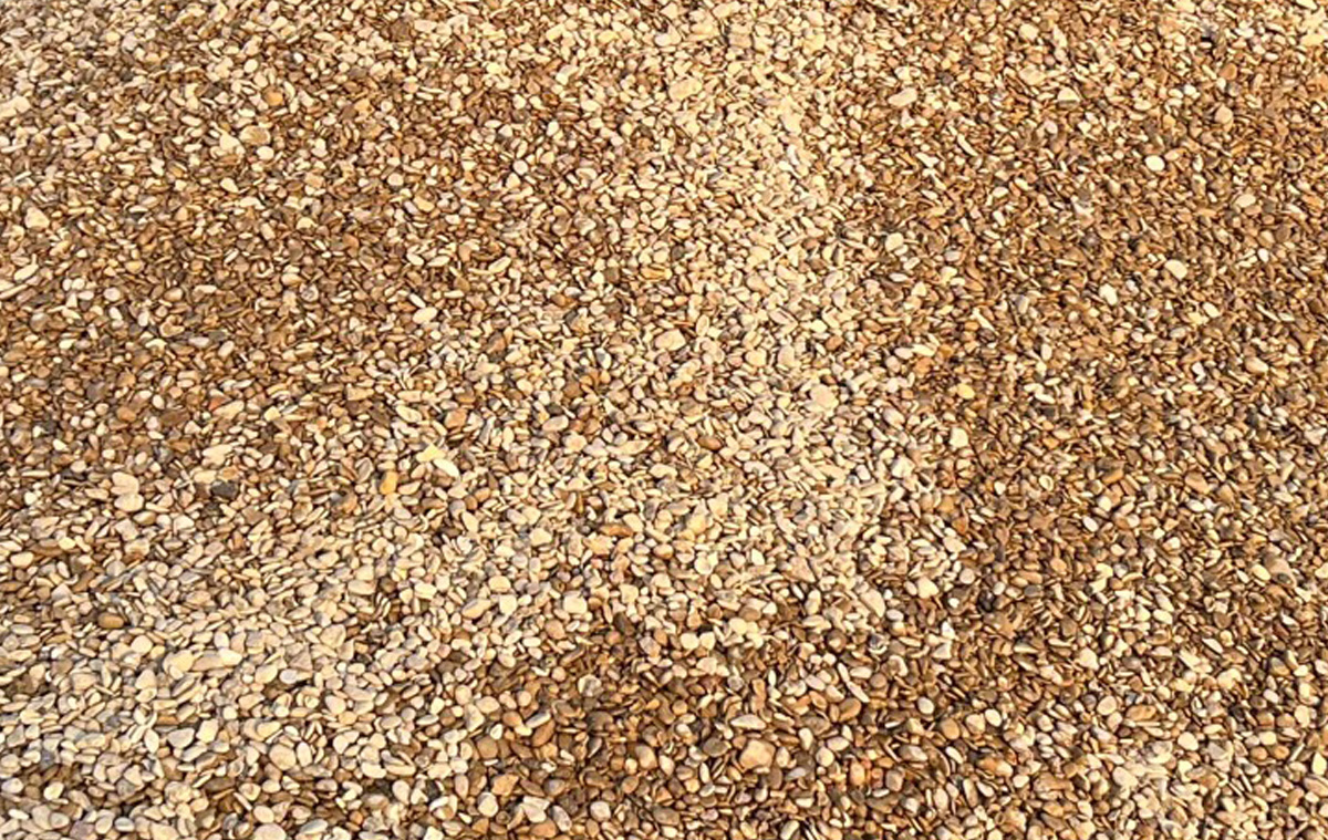 Close-up of a light-colored gravel surface
